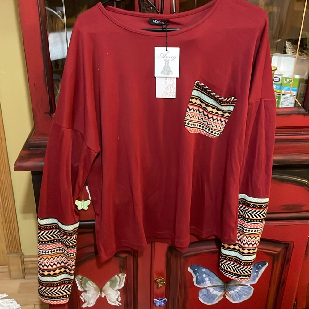 New with tags woman’s Aztec print top. Xl